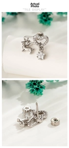 Detail of heart safety pin stud earring with puppy and star charms and screw back closure
