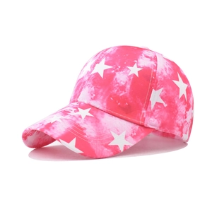Detail of pink tie-dye baseball cap with white star prints and curved brim in close-up view