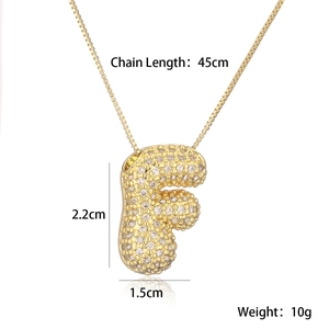 Detail of gold bubble letter F pendant with pave diamonds and 45cm chain length specs