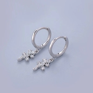 Detail of silver S925 lizard drop earrings with shimmering white zircon stones