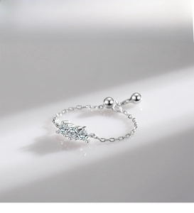 Detail of adjustable S925 silver soft chain ring with three sparkling heart-shaped zircons