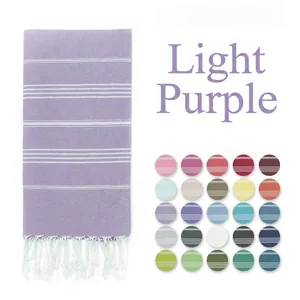 Detail of light purple Turkish towel with white stripes, tassels and 25 color swatches