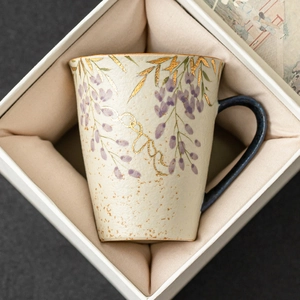 Hand-painted wisteria ceramic mug with gold detailing in an elegant gift box