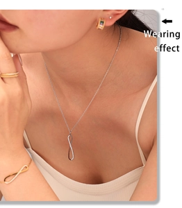 Wearing effect of silver infinity symbol necklace and bracelet set with cubic zirconia