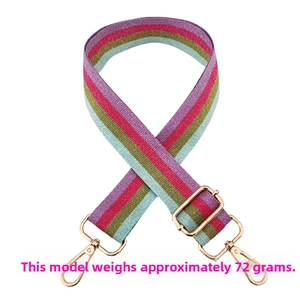Detail of adjustable rainbow striped bag strap with gold metal hooks and 72g weight mark