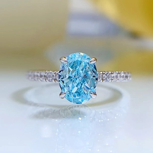 925 silver ring with oval light blue gemstone and shimmering micro-pave diamond band
