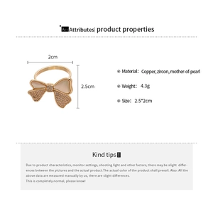 Detail specifications of 14k gold bow ring with copper, zircon, and mother-of-pearl
