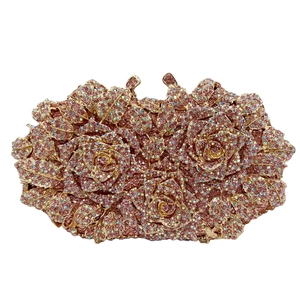 Detailed view of pink rose luxury clutch bag featuring sparkling rhinestone encrustation
