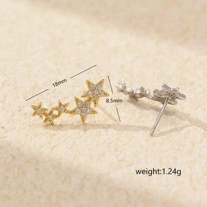 Star-shaped S925 silver stud earrings with crystals in gold and silver finish