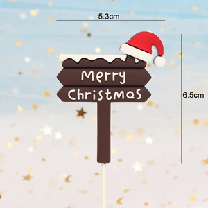 Merry Christmas sign cake topper with red Santa hat and white support rod for holiday decor