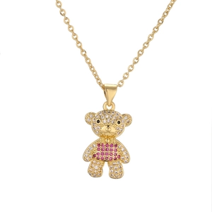 Golden bear necklace with pink and clear crystals on a delicate O-link chain