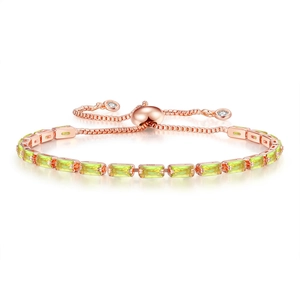 Detail of rose gold adjustable tennis bracelet with rectangular green zircons and sliders