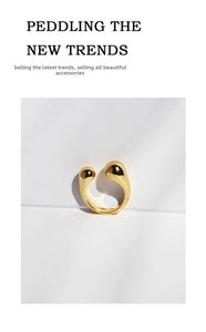 Detailed macro view of an adjustable 18K gold-plated ring with a sleek minimalist design