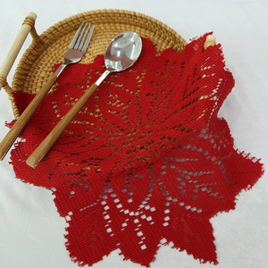 Red 30cm lace knitted round placemat with intricate openwork floral pattern