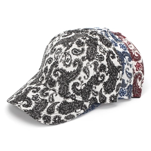 Detailed side view of three paisley baseball caps in black, blue, and red fabric