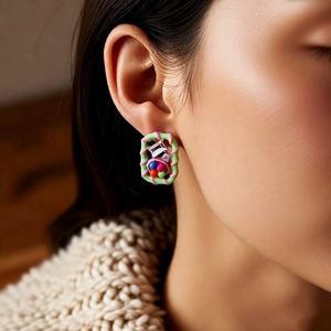 Macro shot of vintage style square resin earrings with colorful beads and small rhinestones