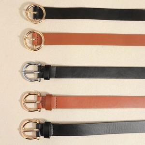 Five assorted women's fashion belts in black and brown with diverse metal buckles