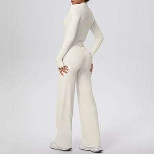 Detail view of high-elasticity off-white workout set showing ribbed fabric texture and seams