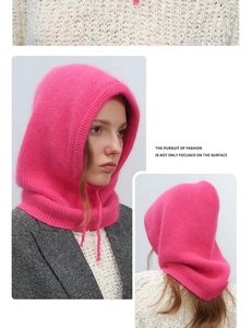 Close-up of rose pink knitted balaclava showing soft texture and integrated hood design