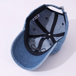 Detail view showing internal black sweatband and denim fabric of children baseball cap
