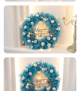 Blue Christmas wreath with silver Merry Christmas sign and warm LED lights on white mantle