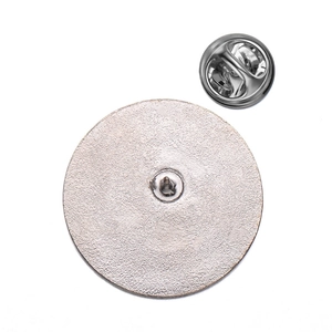 Polished silver metal brooch backings with butterfly clutch pin fasteners on white background