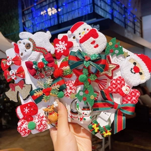 Kerst haaraccessoires set met Kerstman en rendier motieven in rode en groene kleuren