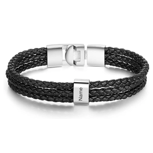 Detailed view of black multi-layer braided leather bracelet with silver magnetic steel clasp