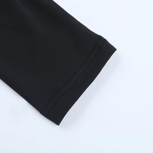 Close-up of black mesh sleeve with high-quality stitching and detailed fabric texture