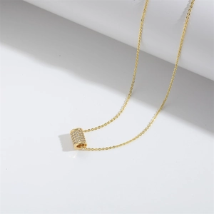 French vintage style gold cylinder pendant necklace with sparkling cubic zirconia