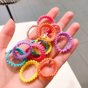 Close-up of seamless wavy elastic hair ties in vibrant candy colors and soft fabric