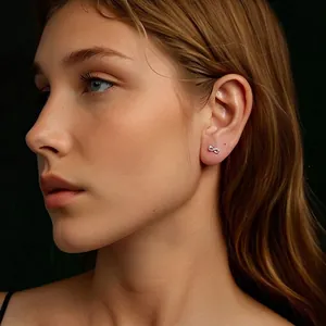 Elegant S925 silver infinity stud earrings with D-color Moissanite on a model