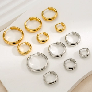 Detailed view of gold and silver stainless steel hoop earrings in various sizes