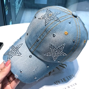 Light blue denim baseball cap with rhinestone star pattern and distressed brim detail