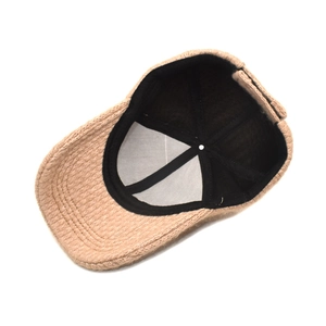 Interior view of a warm khaki winter baseball cap with thick knitted texture and black lining
