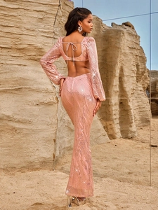Pink sequin evening gown with V-neck, long sleeves, backless top and fishtail skirt
