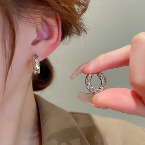 Minimalist silver wrinkled metal hoop earrings with textured finish for women