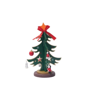 Miniature green wooden Christmas tree with red bow and small ornaments on white background