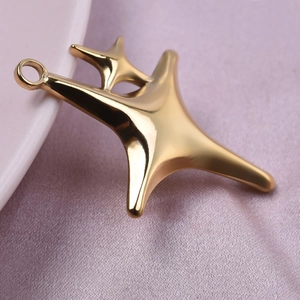 Gold 18k plated 304 stainless steel starfish pendant on purple silk and ceramic dish