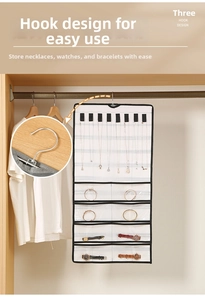 Detail of hanging jewelry organizer with necklace velcro loops and transparent watch pockets