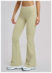 Detail view of high-waist sage green flare yoga leggings with wide tummy control waistband