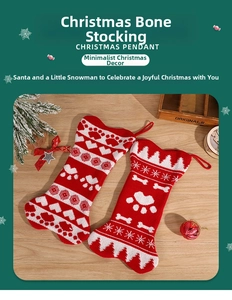 Detail of red and white knitted bone-shaped Christmas stockings with festive patterns