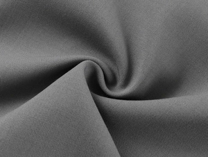Close-up of high-density dark gray knit fabric texture with soft drape and fine fibers