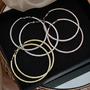 Three pairs of oversized 8cm sparkling rhinestone hoop earrings in gold, silver and rose gold