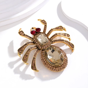 Vintage-Spinnenbrosche aus Bronze mit champagnerfarbenem Kristall und roten Steinen
