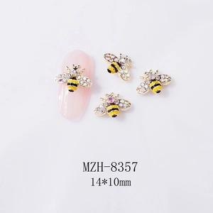 Detailed view of 3D bee nail art charm with rhinestones and yellow enamel 14x10mm size