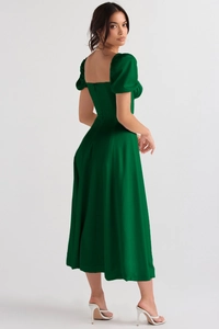 Detail view of the deep green satin floral dress showing back cut and puff sleeves