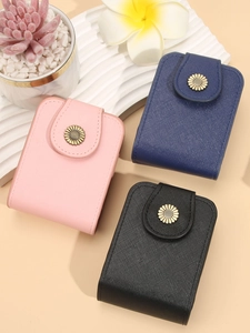 Mini makeup bag with mirror and sunflower clasp in pink, navy blue, and black