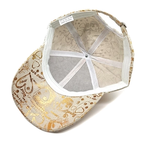 Detail showing 100% polyester inner lining with gold foil anime print and metal buckle