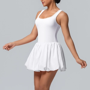 Detail view of the voluminous white bubble skirt hem and fitted sleeveless bodice fabric